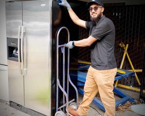 man pulling out the refrigerator